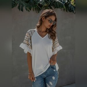 White V neck top with ruffles on the sleeves